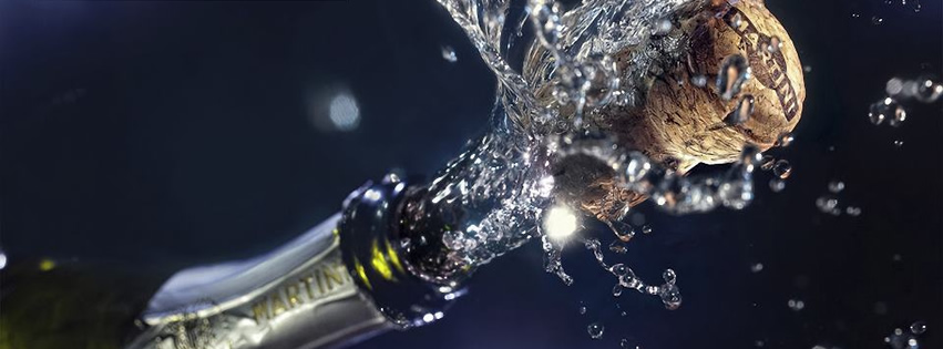 Capa para Facebook de Ano Novo com garrafa de champagne estourando